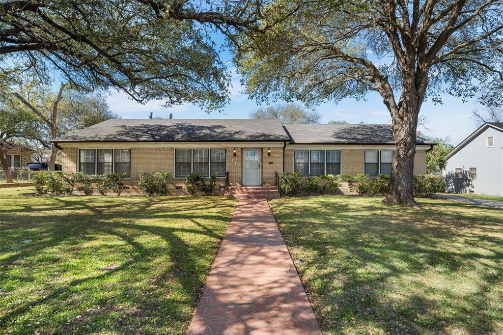 3117 Colcord Avenue Waco, TX 76707 - Photo 2 of 26 a front view of a house with a yard