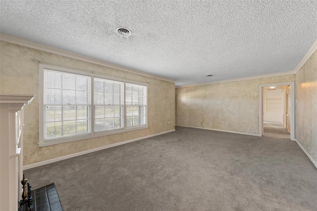 3117 Colcord Avenue Waco, TX 76707 - Photo 4 of 26 an empty room with a empty space and windows