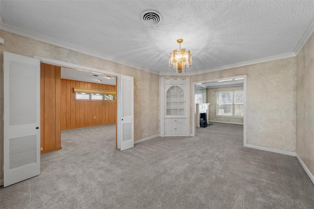 3117 Colcord Avenue Waco, TX 76707 - Photo 8 of 26 an empty room with chandelier and closet