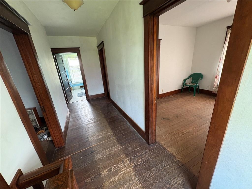 4561 Rte 210 Highway Smicksburg, PA 16256 - Photo 19 of 32 a view of a hallway with wooden floor and stairs