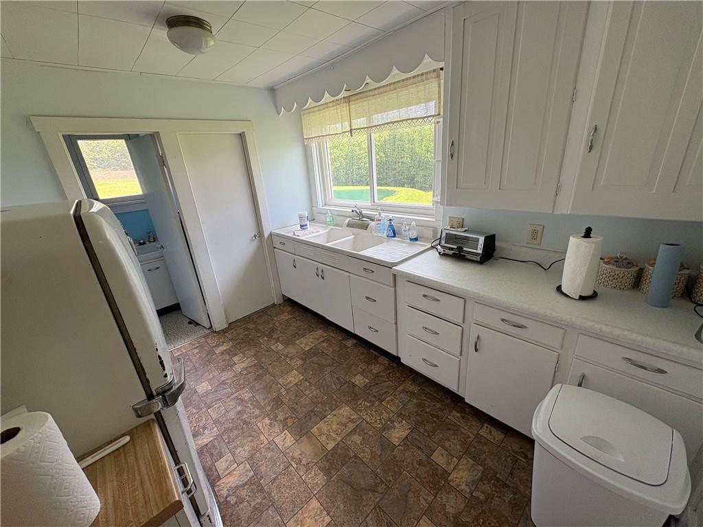 4561 Rte 210 Highway Smicksburg, PA 16256 - Photo 8 of 32 a bathroom with a granite countertop sink mirror vanity and toilet
