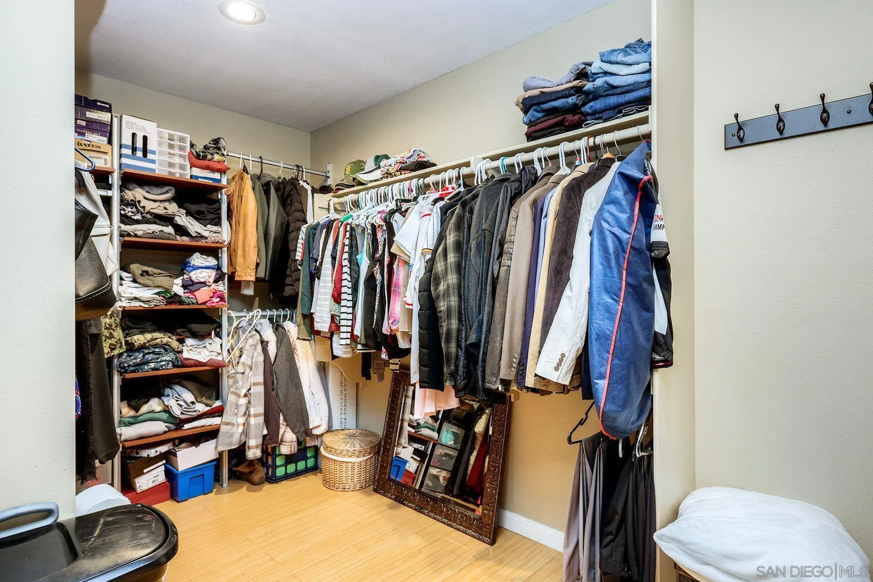13976 Country Creek Road Poway, CA 92064 - Photo 21 of 40 a view of walk in closet with clothes and shoes