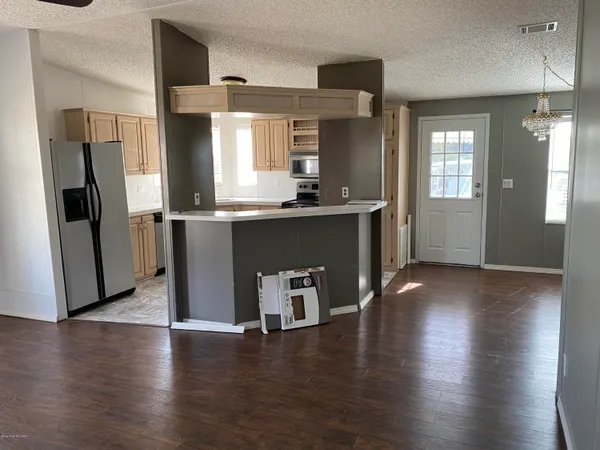 a kitchen with counter top space and stainless steel appliances