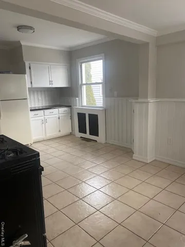 a kitchen with a cabinets and window