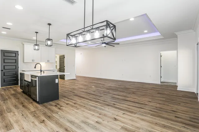 a view of kitchen with wooden floor and window