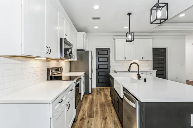 a close view of a sink and dishwasher in a kitchen