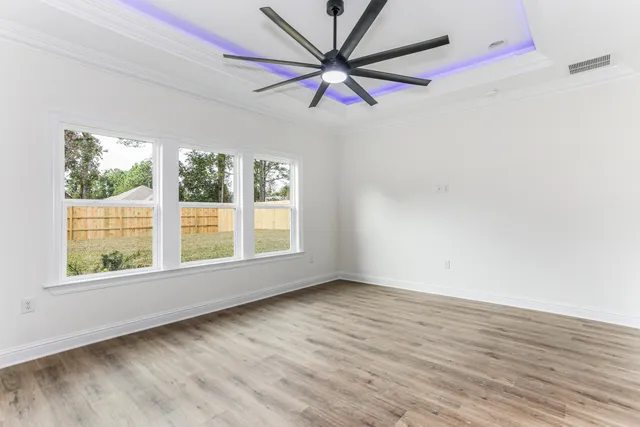 a spacious bathroom with a double vanity sink a mirror and shower