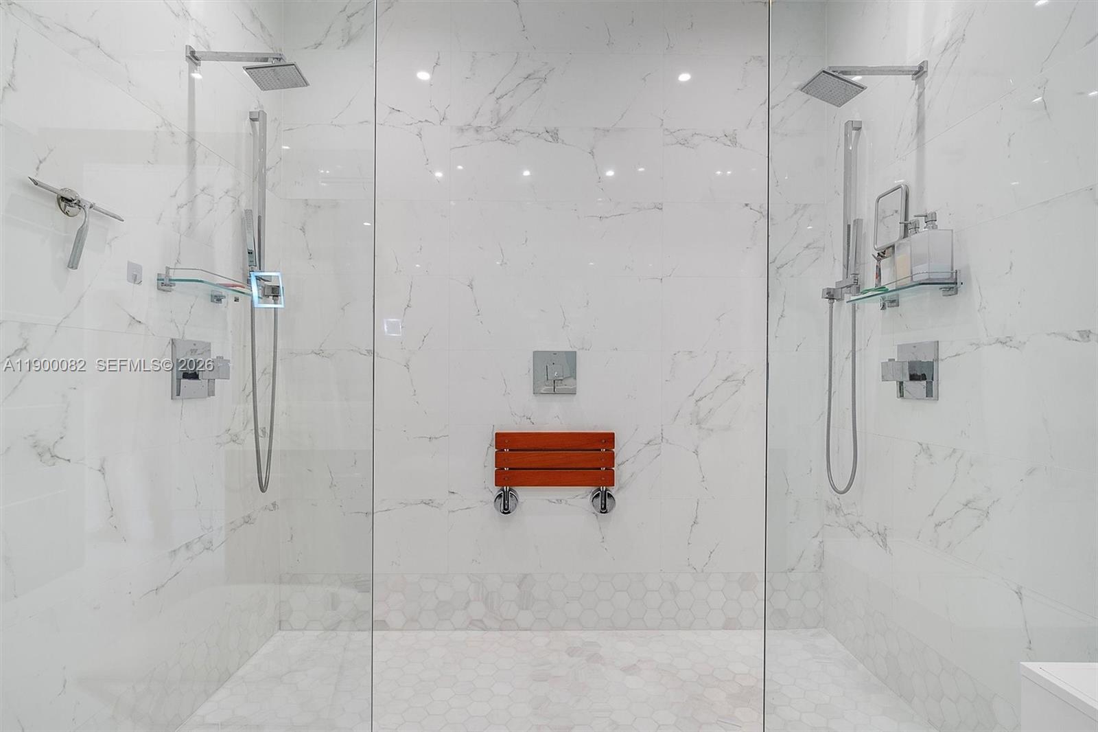 900 Brickell Key Boulevard, Unit 3103 Miami, FL 33131 - Photo 30 of 54 a bathroom with a shower