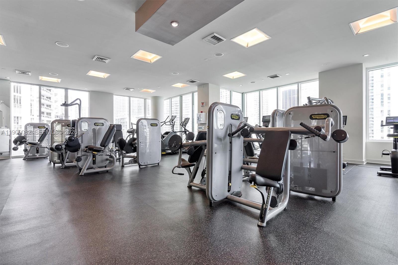 900 Brickell Key Boulevard, Unit 3103 Miami, FL 33131 - Photo 46 of 54 a view of a room with gym equipment