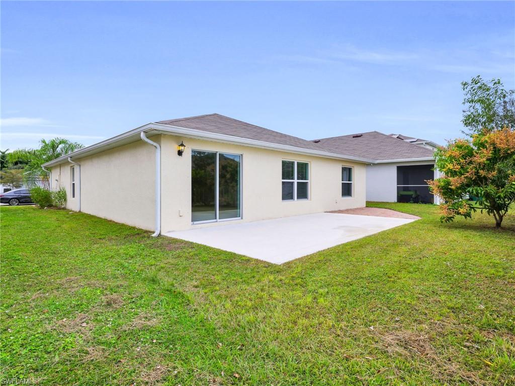 731 Hadley Place West Naples, FL 34104 - Photo 28 of 30 Rear View of Yard, Paver Patio And Concrete Pad
