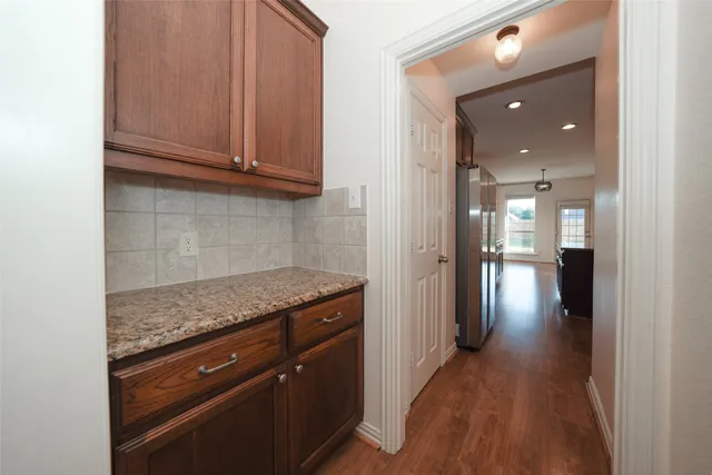 a view of a kitchen cabinets and wooden floor