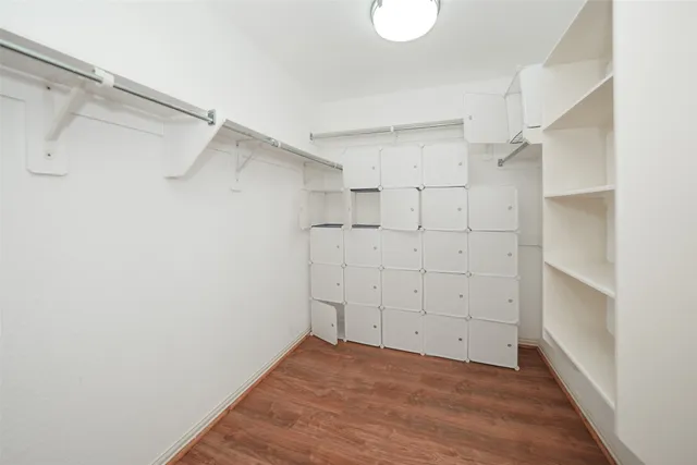 a view of an empty walk in closet