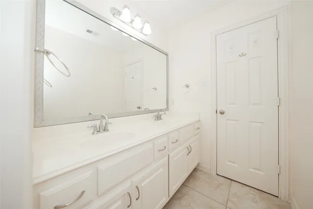 a white bath tub sitting next to a white toilet and a shower