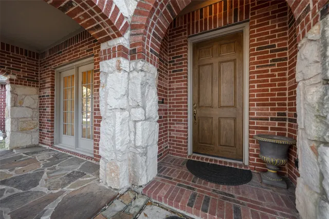 a view of a wooden door of the house