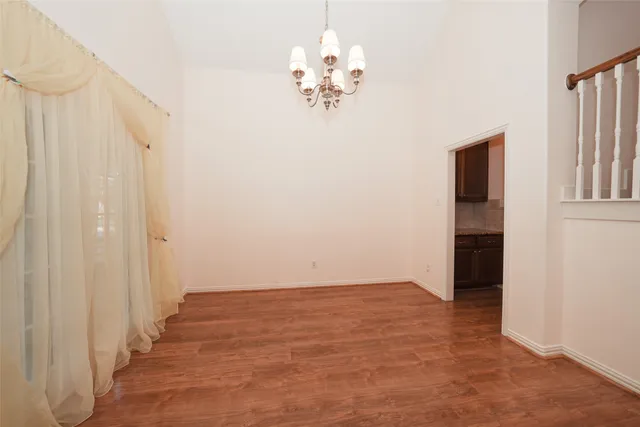 a view of a chandelier in an empty room