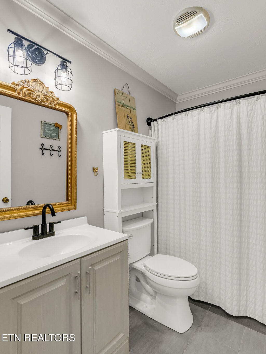 170 Cedar Circle Powell, TN 37849 - Photo 16 of 27 a bathroom with a sink a toilet and shower curtain