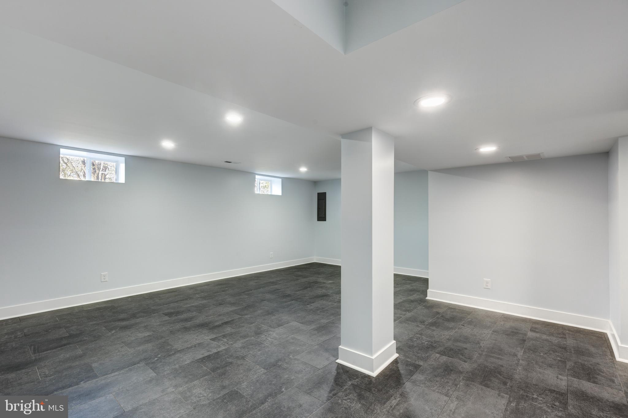 1030 Mckinstrys Mill Road Union Bridge, MD 21791 - Photo 22 of 43 an empty room with wooden floor and windows