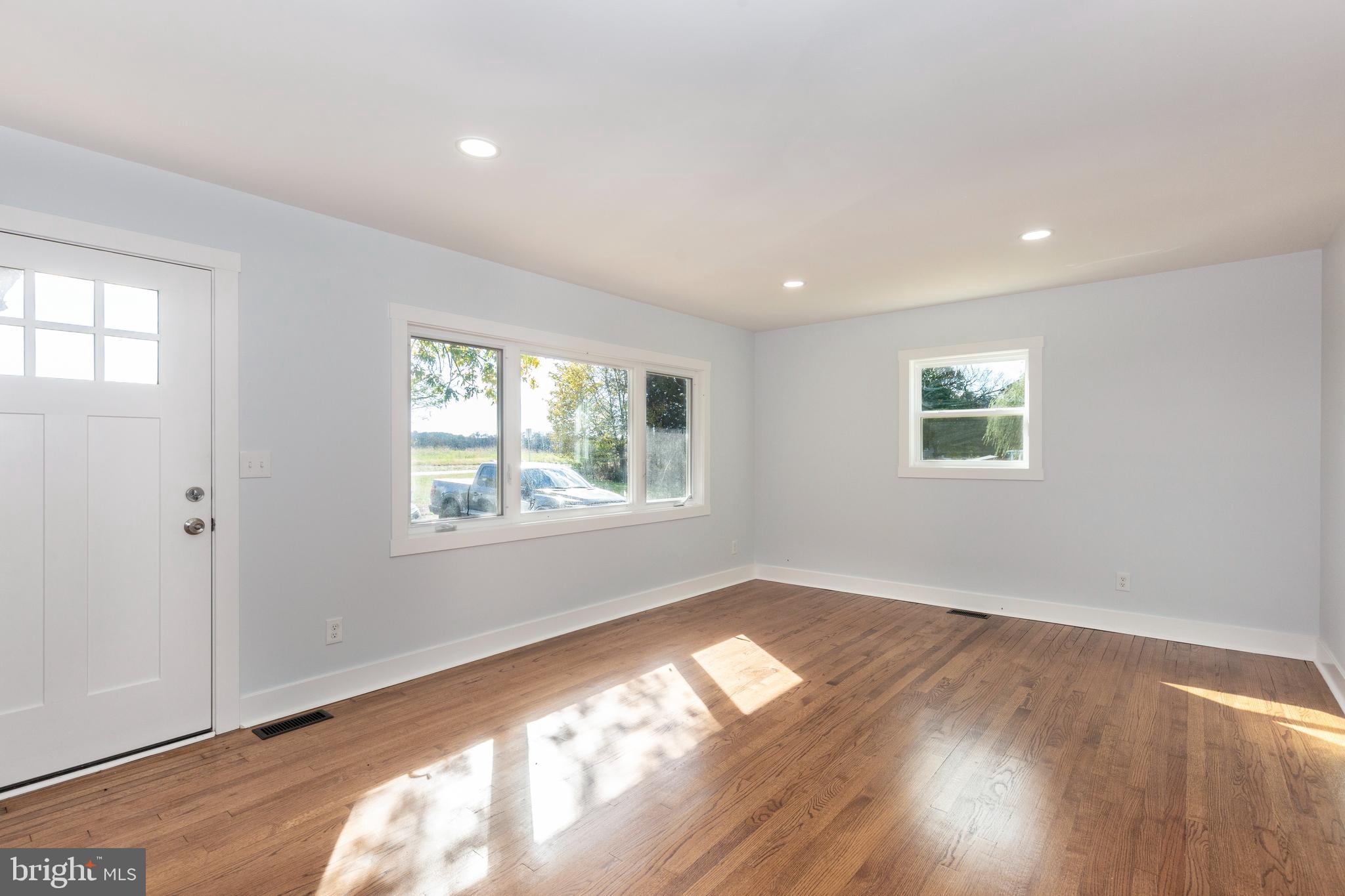1030 Mckinstrys Mill Road Union Bridge, MD 21791 - Photo 3 of 43 a view of an empty room with wooden floor and a window