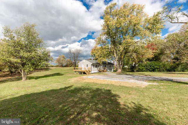 a view of a swimming pool with an outdoor space and seating area