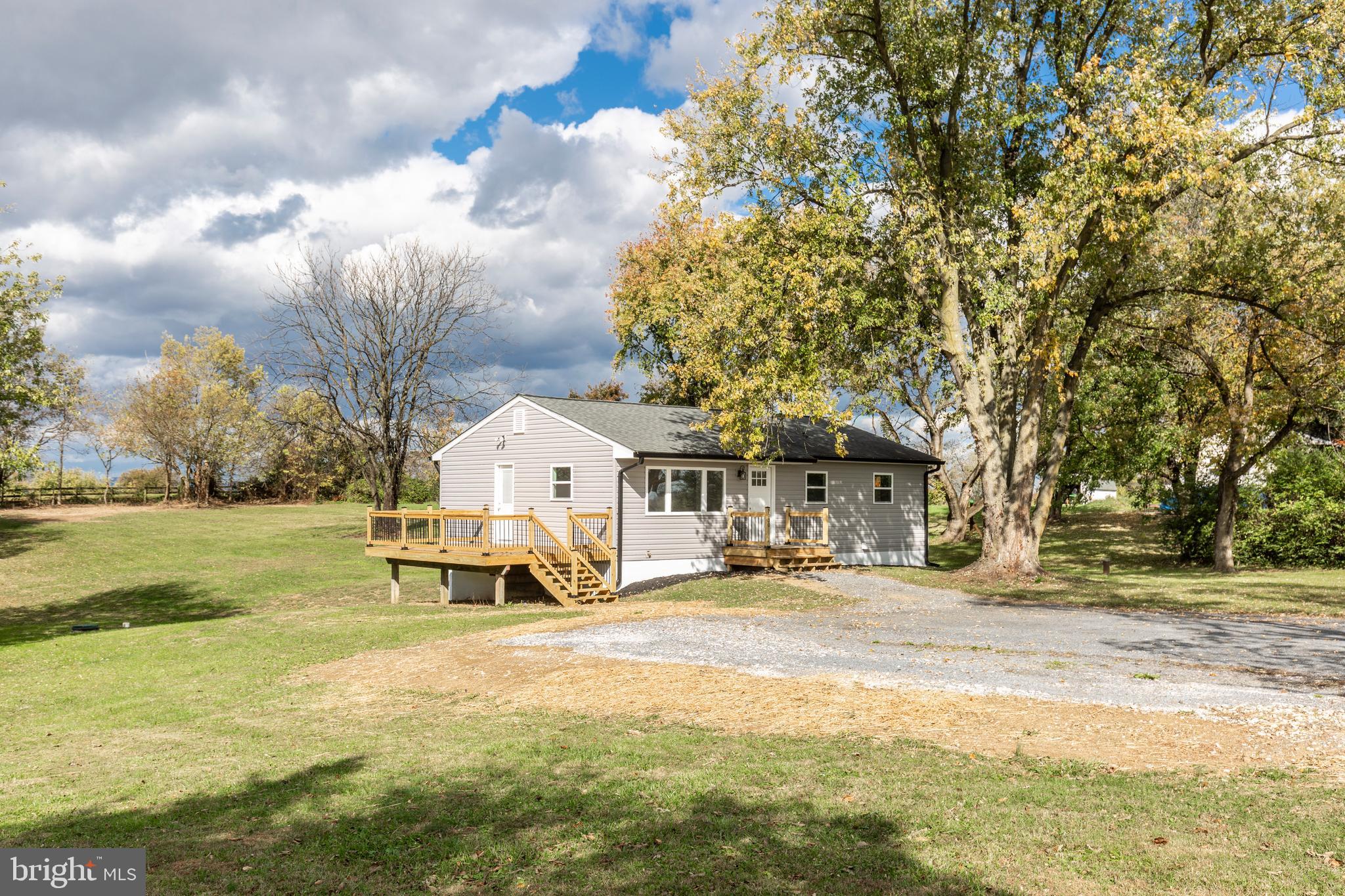 1030 Mckinstrys Mill Road Union Bridge, MD 21791 - Photo 37 of 43 a house with trees in front of it