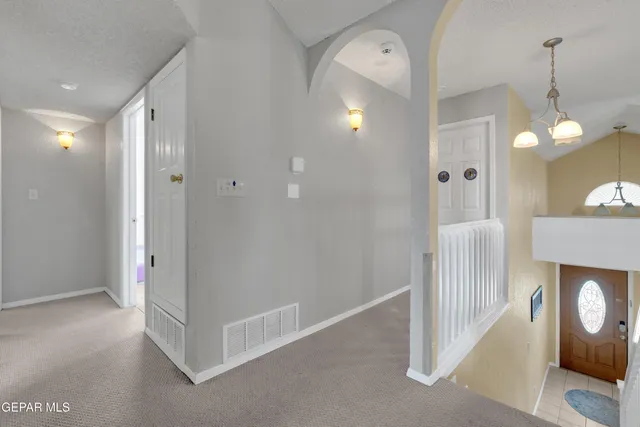 a view of a hallway with entryway