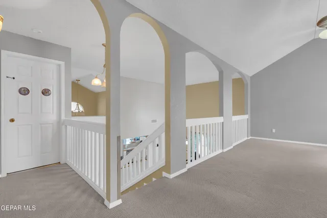 a view of a livingroom with wooden floor and entryway