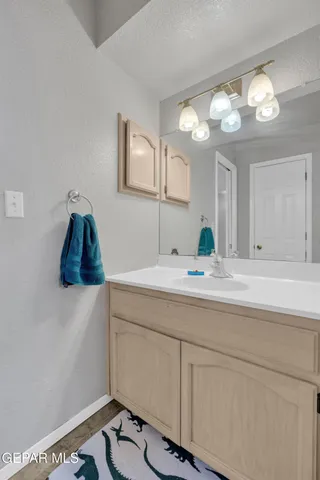 a bathroom with a sink and a mirror