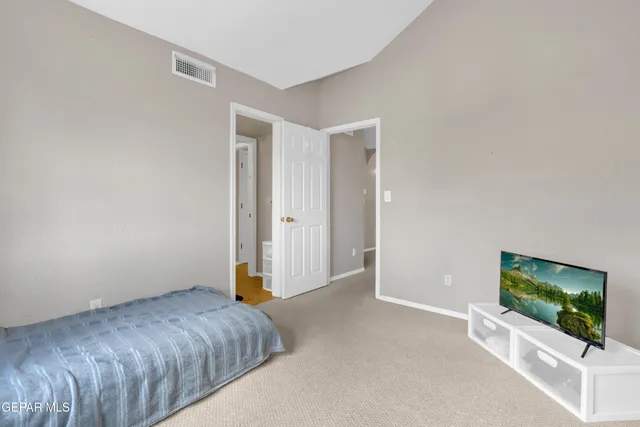 a view of a house with a yard and tree