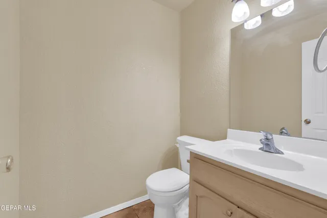 a kitchen with stainless steel appliances a refrigerator and cabinets