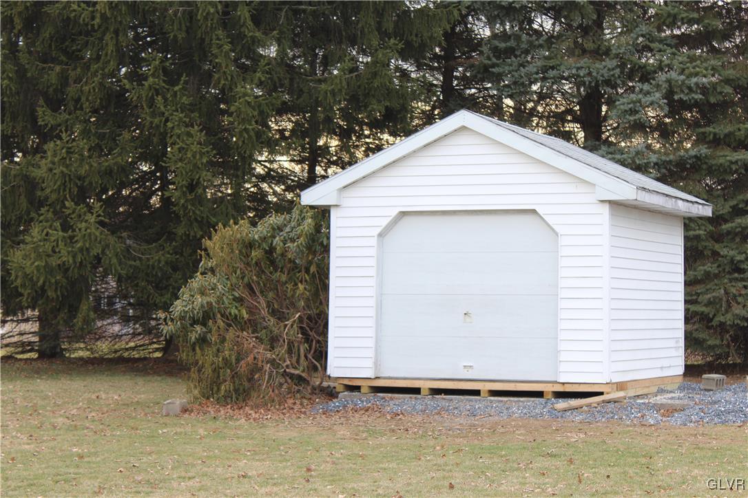 1227 Clearfield Road Nazareth, PA 18064 - Photo 3 of 18 a view of a small house with a yard and garage