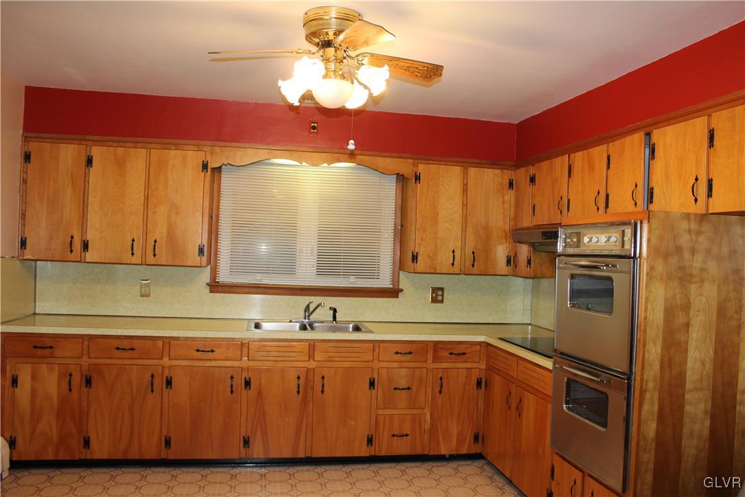 1227 Clearfield Road Nazareth, PA 18064 - Photo 4 of 18 a kitchen with stainless steel appliances granite countertop a sink a stove and a refrigerator