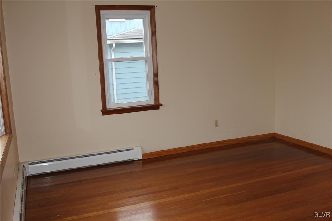 1227 Clearfield Road Nazareth, PA 18064 - Photo 7 of 18 a view of a small space with wooden floor and a window