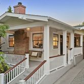 a view of a brick house with a iron gate