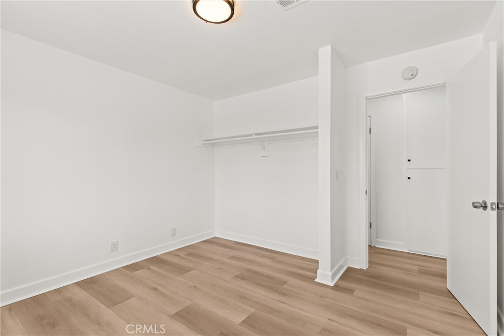 2852 East San Angelo Road Palm Springs, CA 92262 - Photo 18 of 25 a view of a room with wooden floor