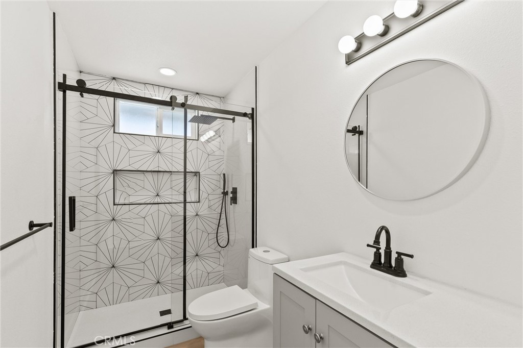 2852 East San Angelo Road Palm Springs, CA 92262 - Photo 19 of 25 a bathroom with a sink toilet and shower