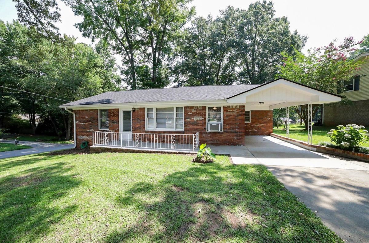276 Valley Road Northwest Lawrenceville, GA 30044 - Photo 1 of 1 a view of a house with a yard and sitting area
