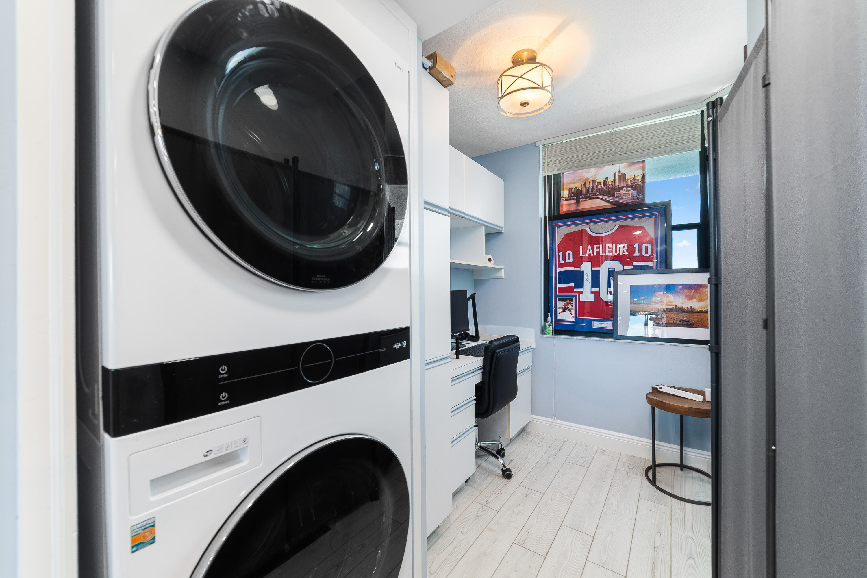 8800 South Ocean Drive, Unit 1102 Jensen Beach, FL 34957 - Photo 11 of 39 a view of livingroom with washer and dryer