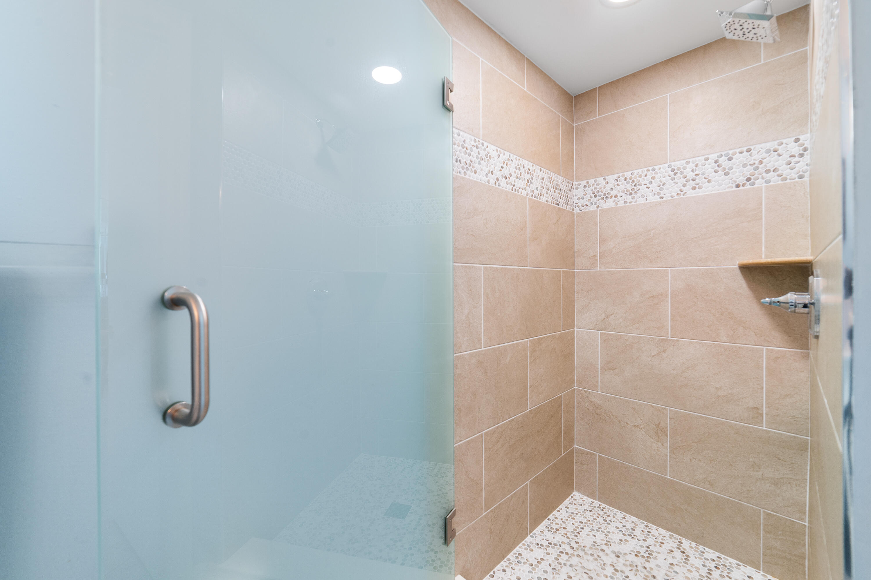 8800 South Ocean Drive, Unit 1102 Jensen Beach, FL 34957 - Photo 16 of 39 a bathroom with a shower