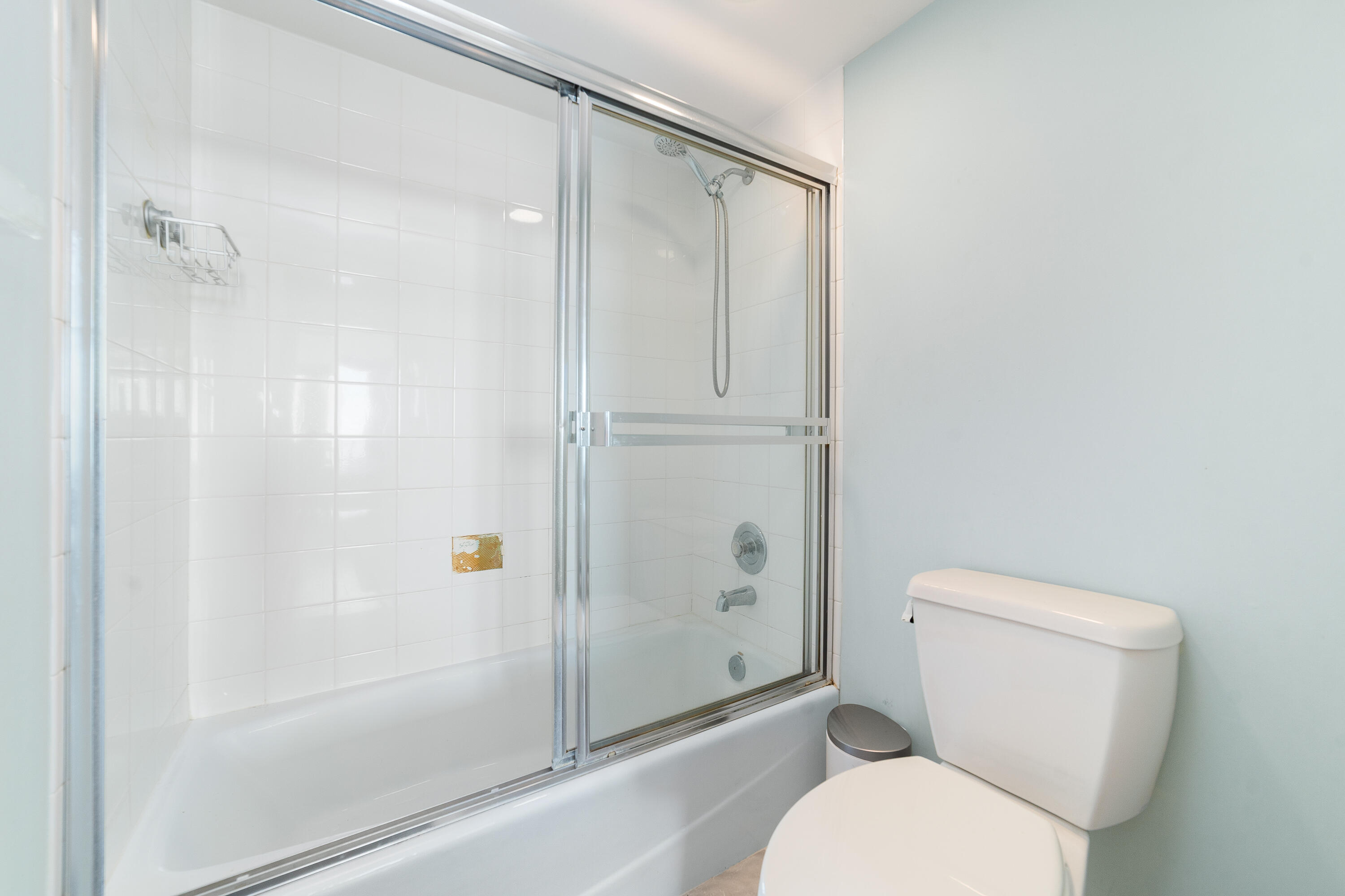 8800 South Ocean Drive, Unit 1102 Jensen Beach, FL 34957 - Photo 23 of 39 a white toilet sitting next to a bathroom