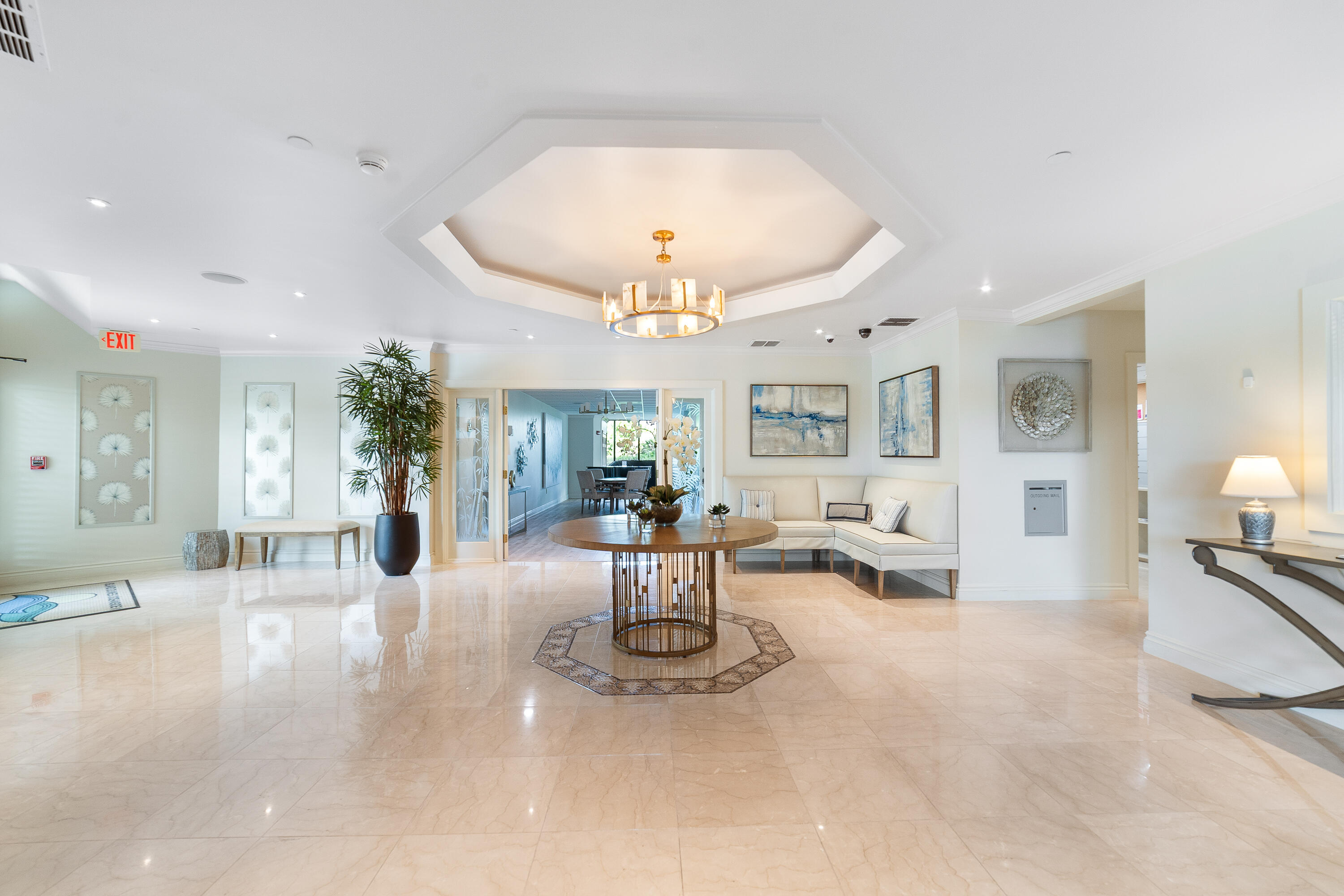 8800 South Ocean Drive, Unit 1102 Jensen Beach, FL 34957 - Photo 26 of 39 a view of a livingroom with furniture and a chandelier