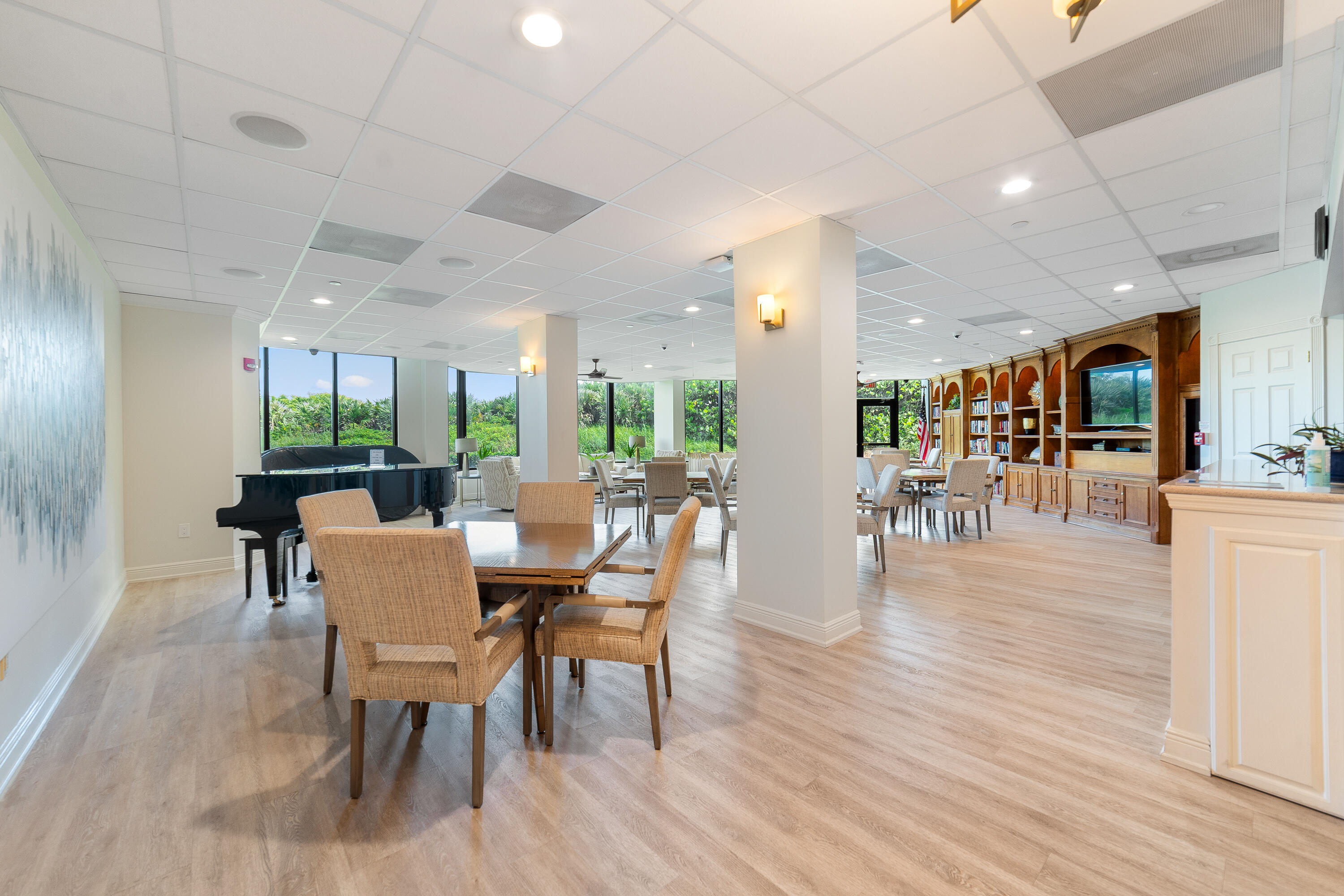 8800 South Ocean Drive, Unit 1102 Jensen Beach, FL 34957 - Photo 28 of 39 a view of a dining room with furniture window and wooden floor