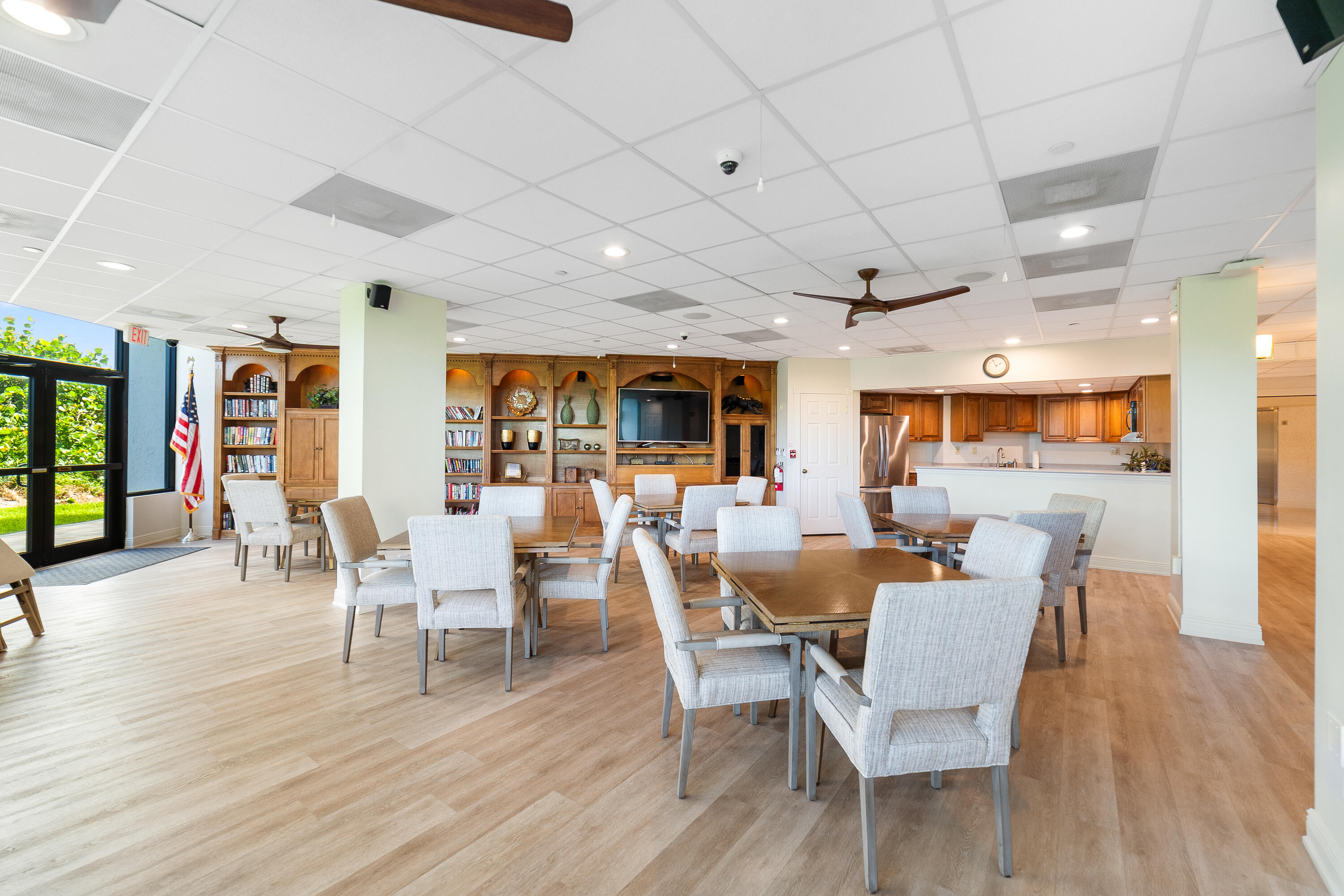 8800 South Ocean Drive, Unit 1102 Jensen Beach, FL 34957 - Photo 29 of 39 a view of a dining room with furniture window and wooden floor