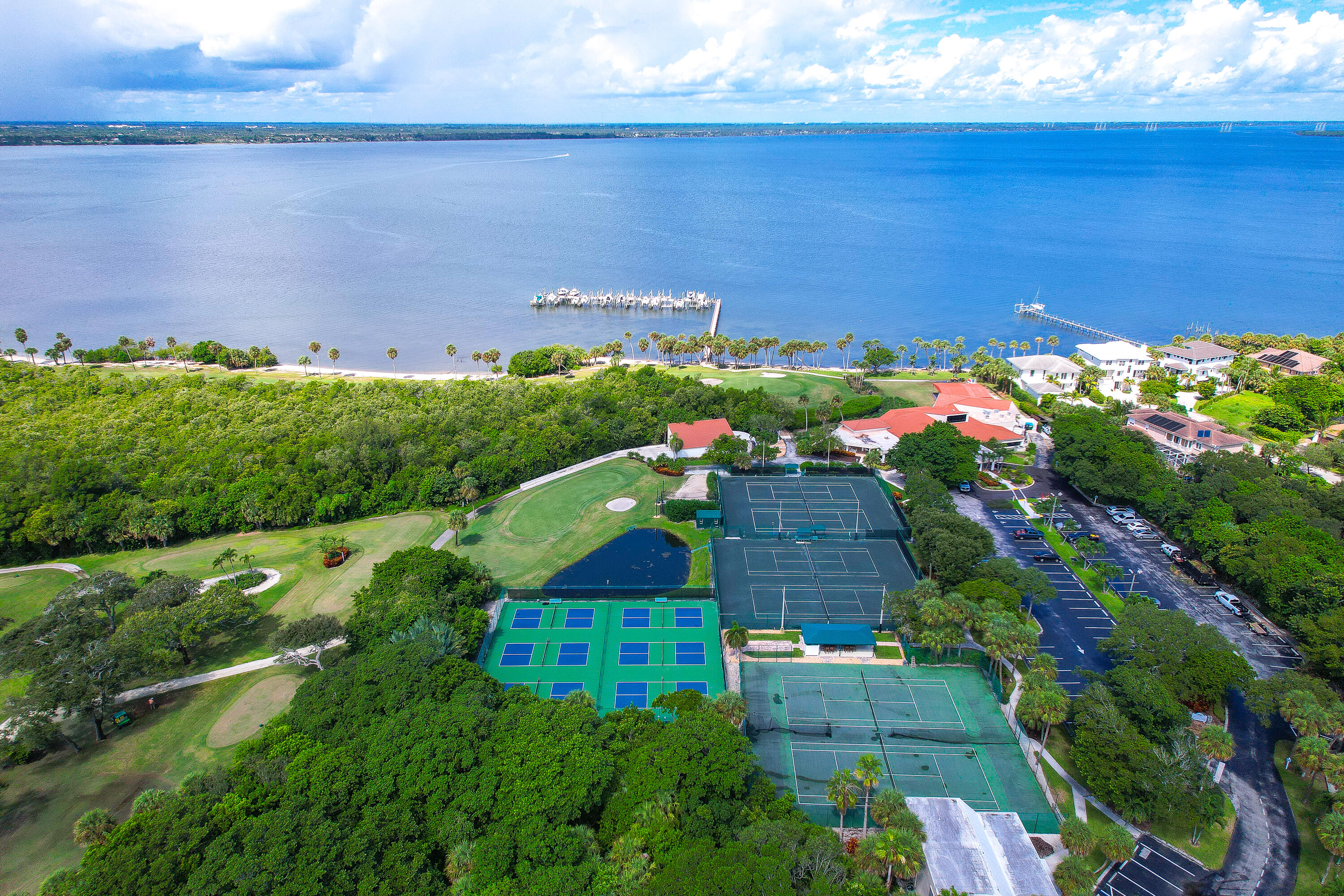 8800 South Ocean Drive, Unit 1102 Jensen Beach, FL 34957 - Photo 38 of 39 a view of a garden with a building in the background