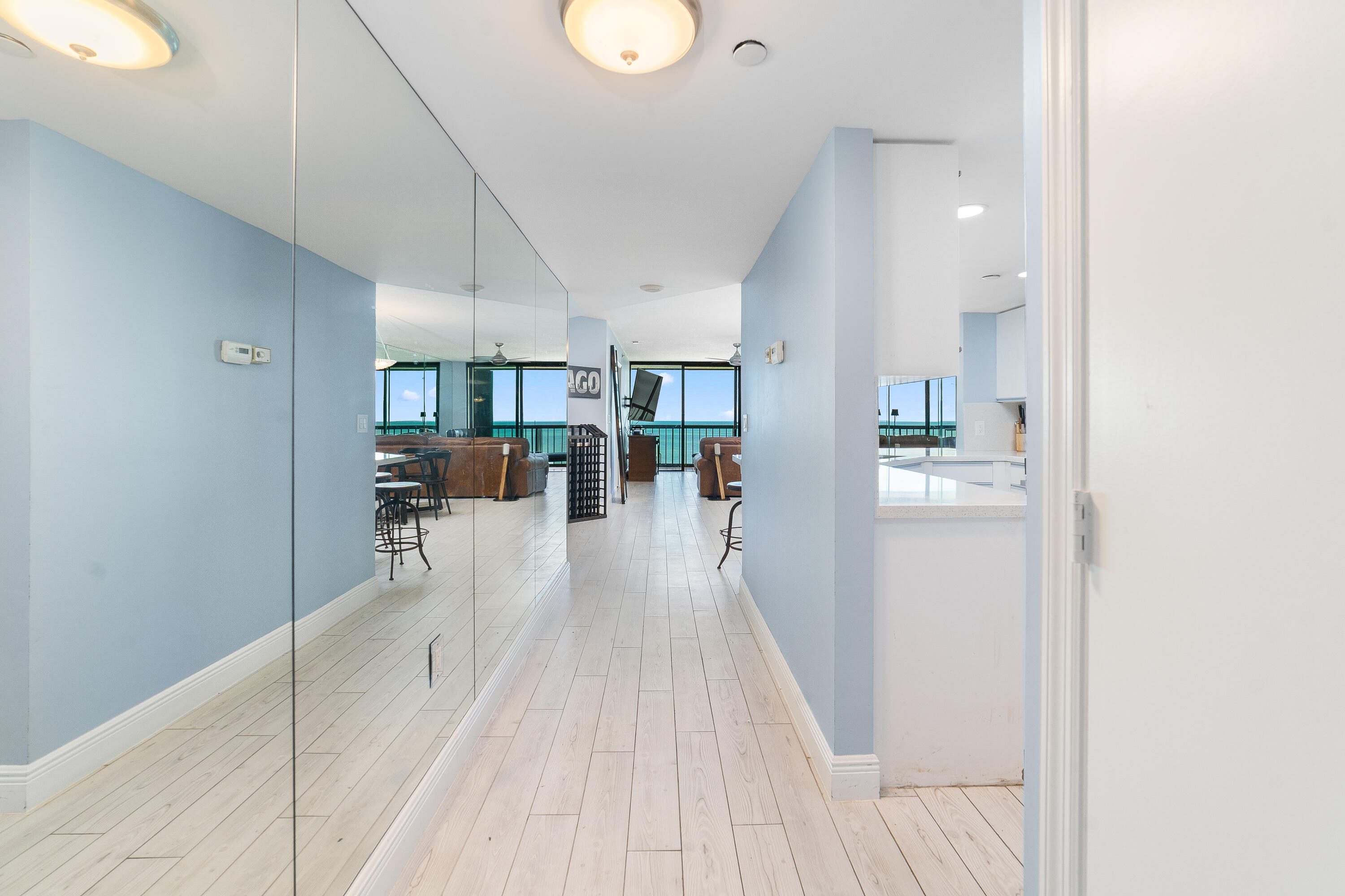 8800 South Ocean Drive, Unit 1102 Jensen Beach, FL 34957 - Photo 4 of 39 a view of kitchen with furniture and wooden floor