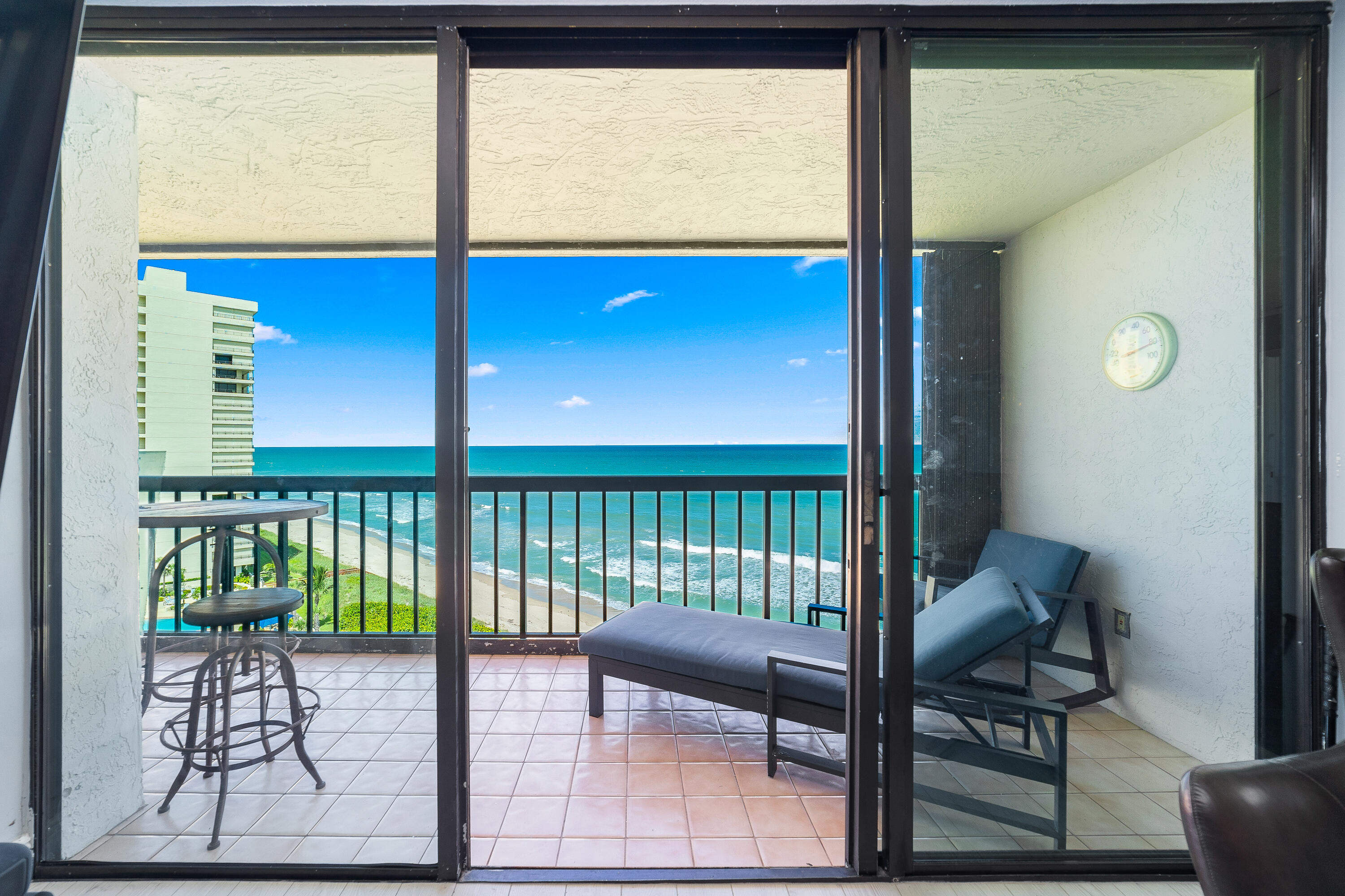 8800 South Ocean Drive, Unit 1102 Jensen Beach, FL 34957 - Photo 7 of 39 a view of a porch with furniture and a window