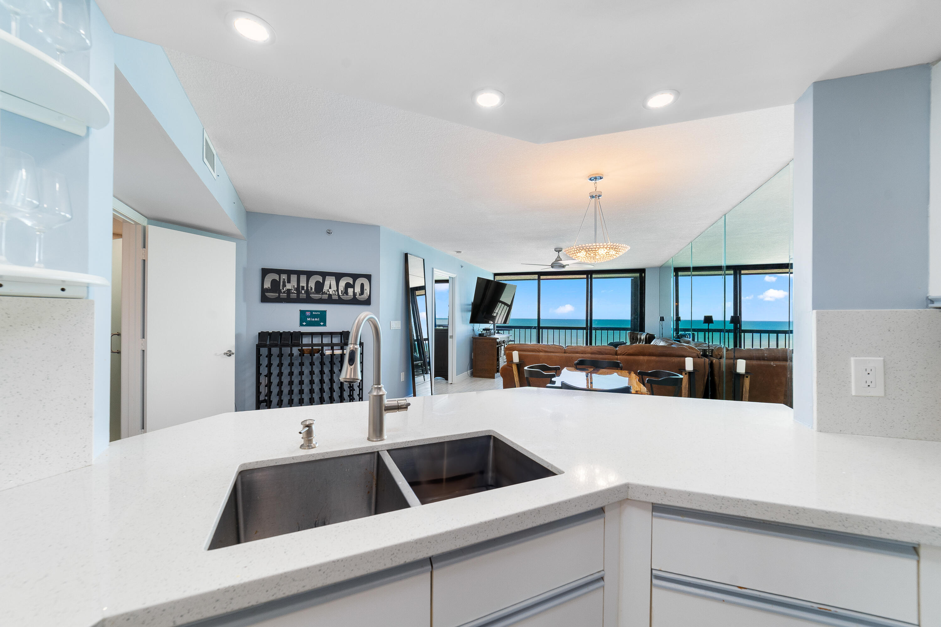 8800 South Ocean Drive, Unit 1102 Jensen Beach, FL 34957 - Photo 9 of 39 a view of a kitchen with a sink and a refrigerator