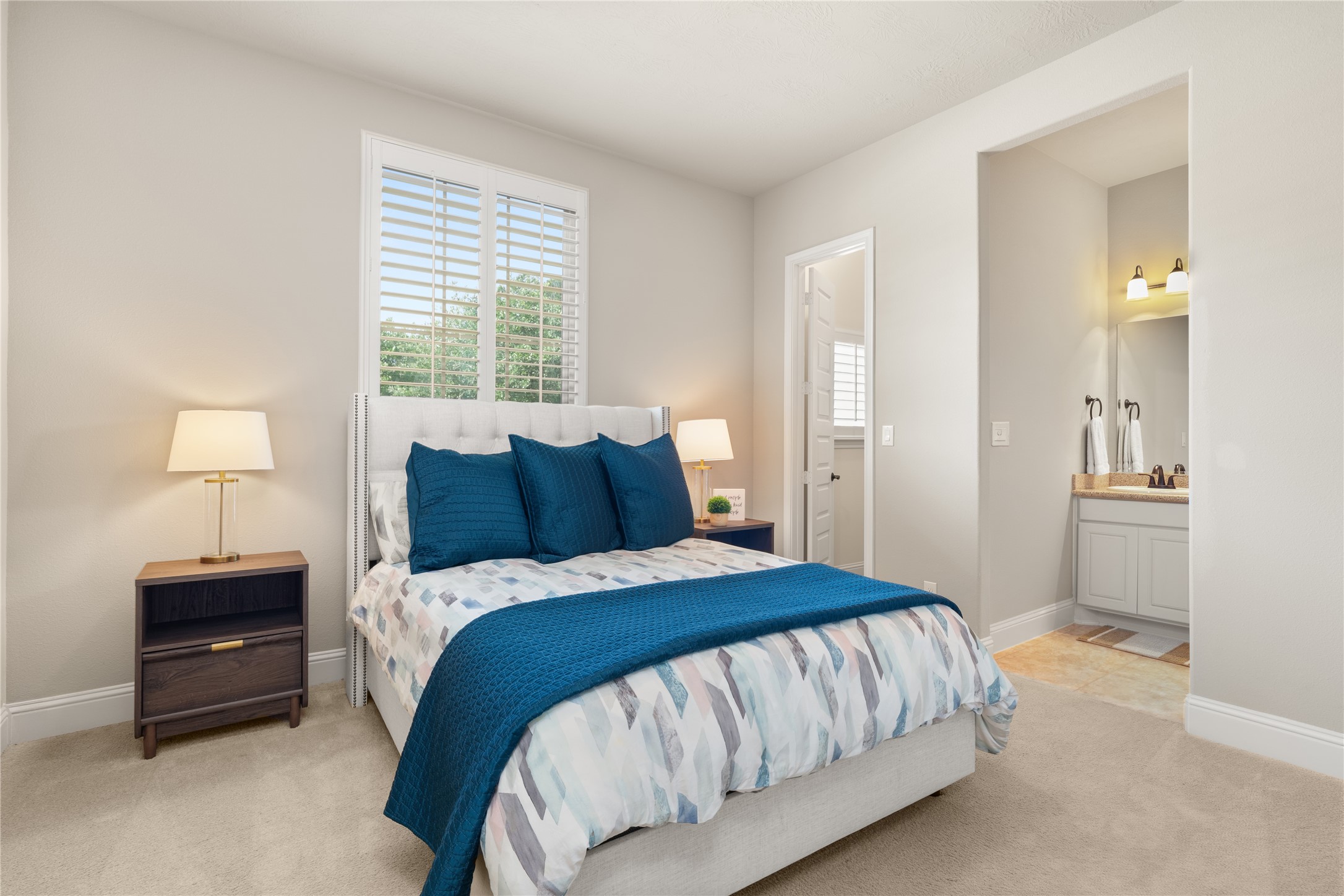 19813 Cullen Ridge Drive Porter, TX 77365 - Photo 30 of 44 Experience comfort and convenience in this inviting bedroom featuring a stylish Jack and Jill bathroom.
