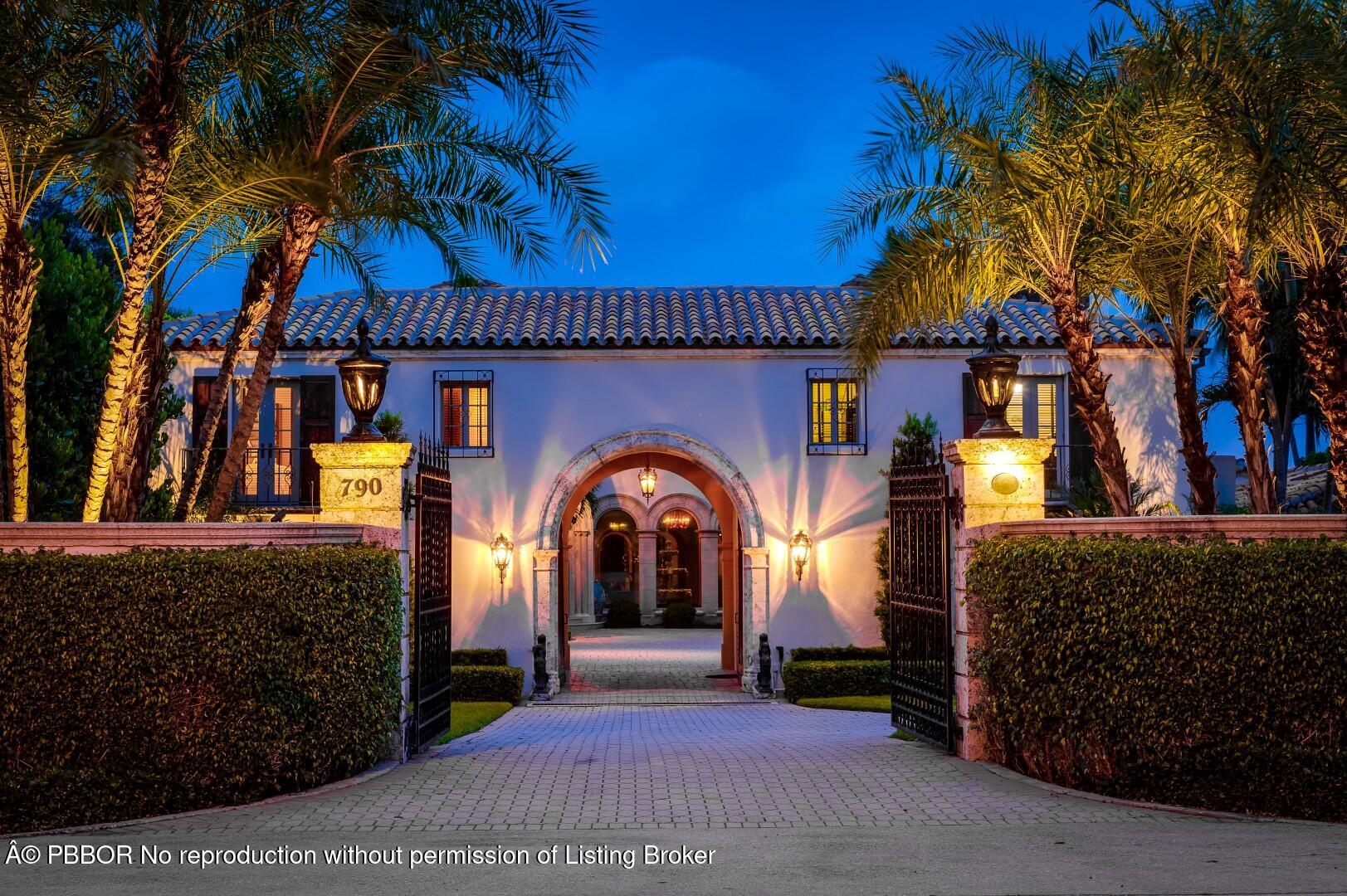 790 South County Road Palm Beach, FL 33480 - Photo 2 of 15 a front view of a house with a garden
