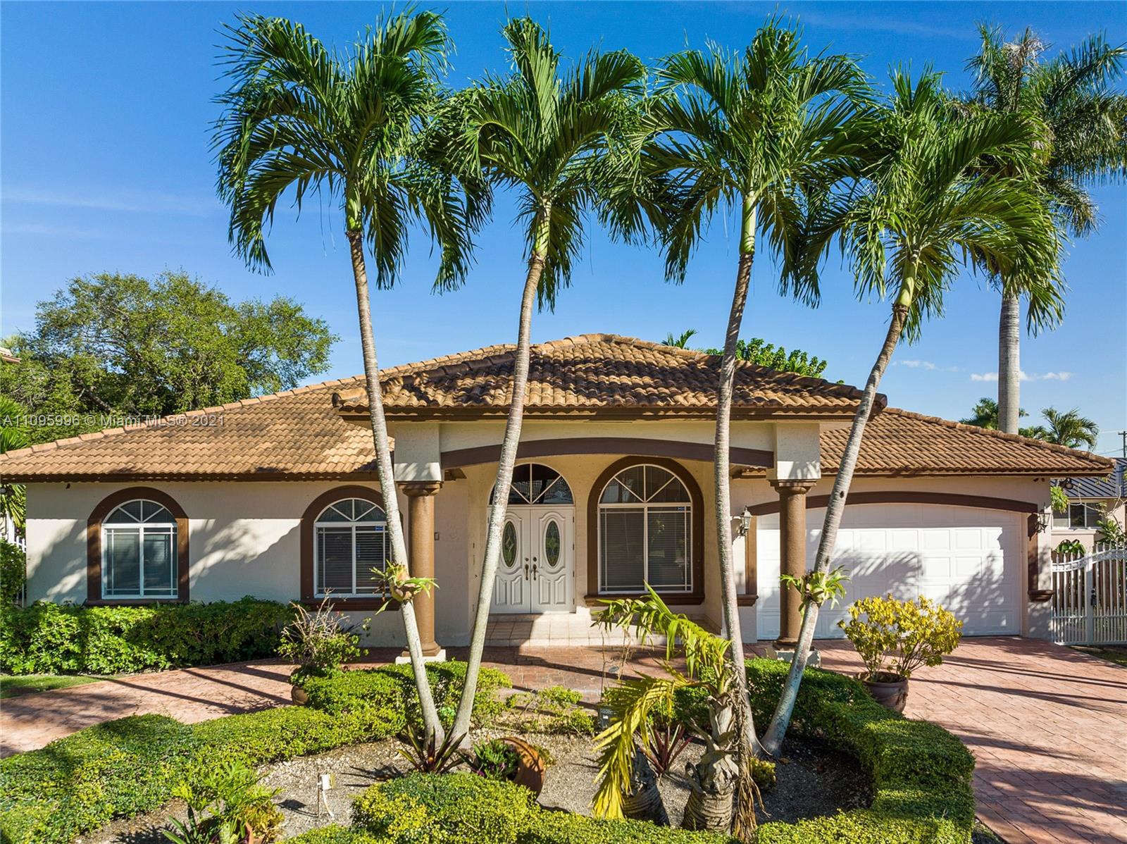 3671 Southwest 139th Court Miami, FL 33175 - Photo 2 of 56 a view of a house with a yard and palm trees