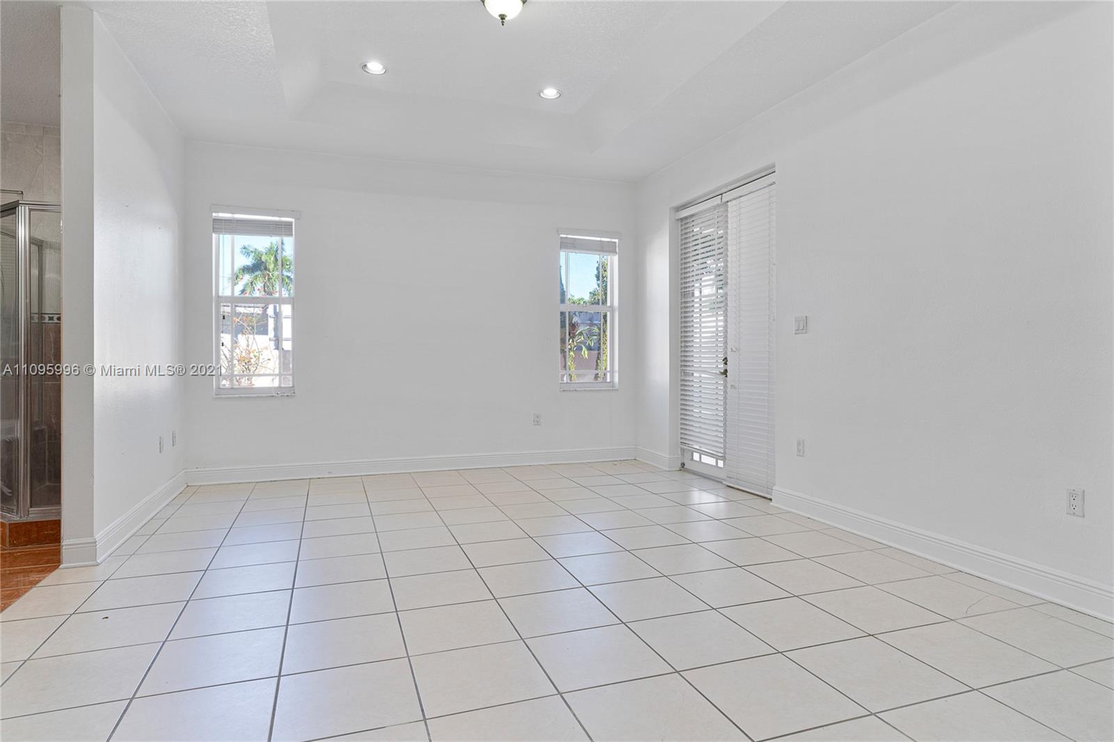 3671 Southwest 139th Court Miami, FL 33175 - Photo 21 of 56 an empty room with windows and closet